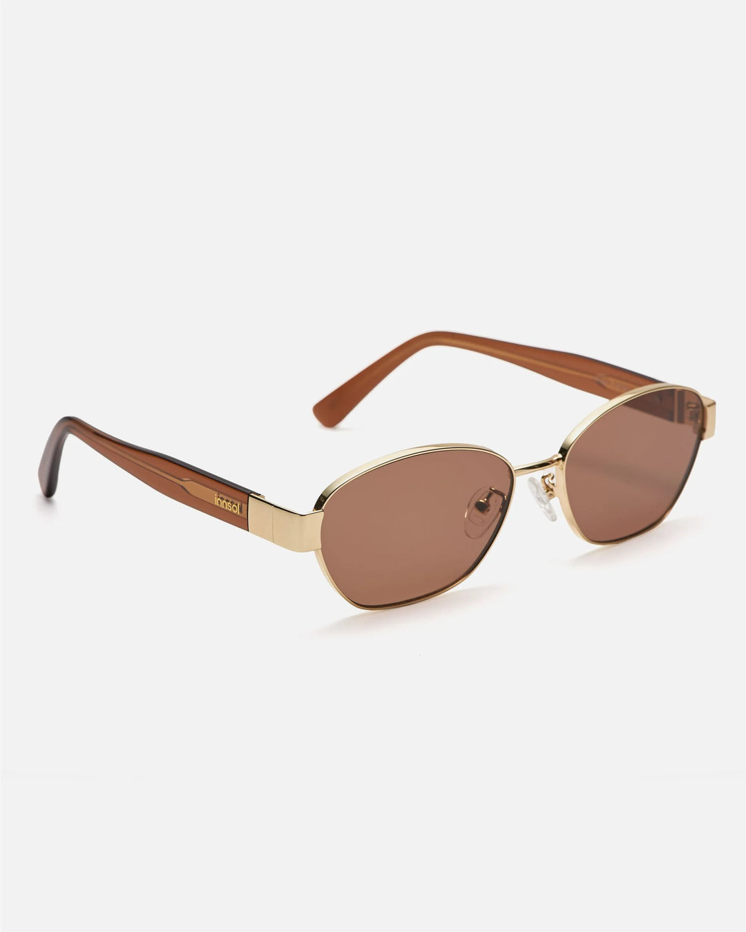 Side view of innsol Bate sunglasses showing gold metal frame and brown lenses