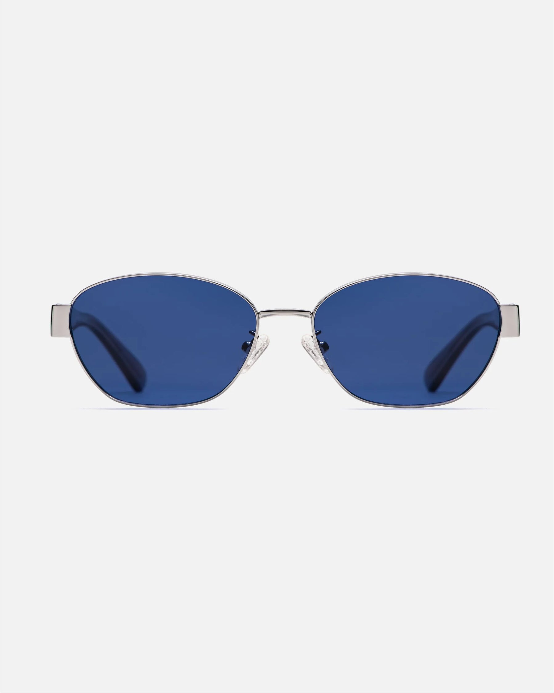 innsol Bate Y2K oval cat eye metal sunglasses with silver frame and tinted dark blue UV400 lenses