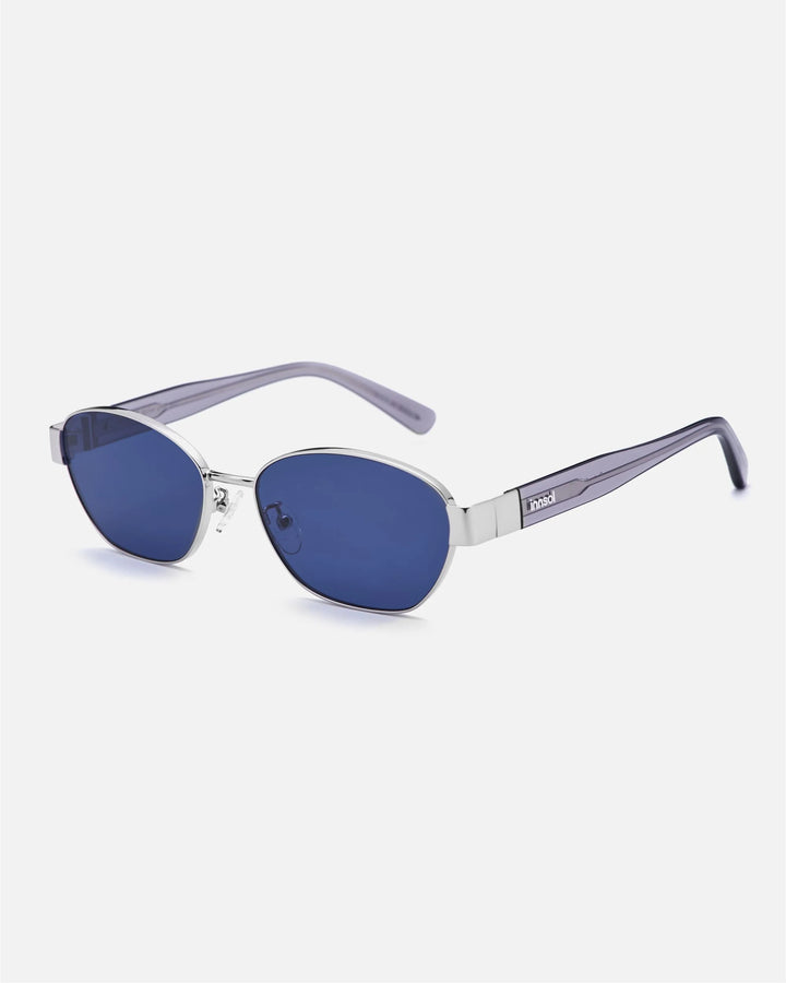 Alternate side angle of innsol Bate sunglasses featuring metal oval cat eye frame, adjustable nose pads, and refined temple detail in silver