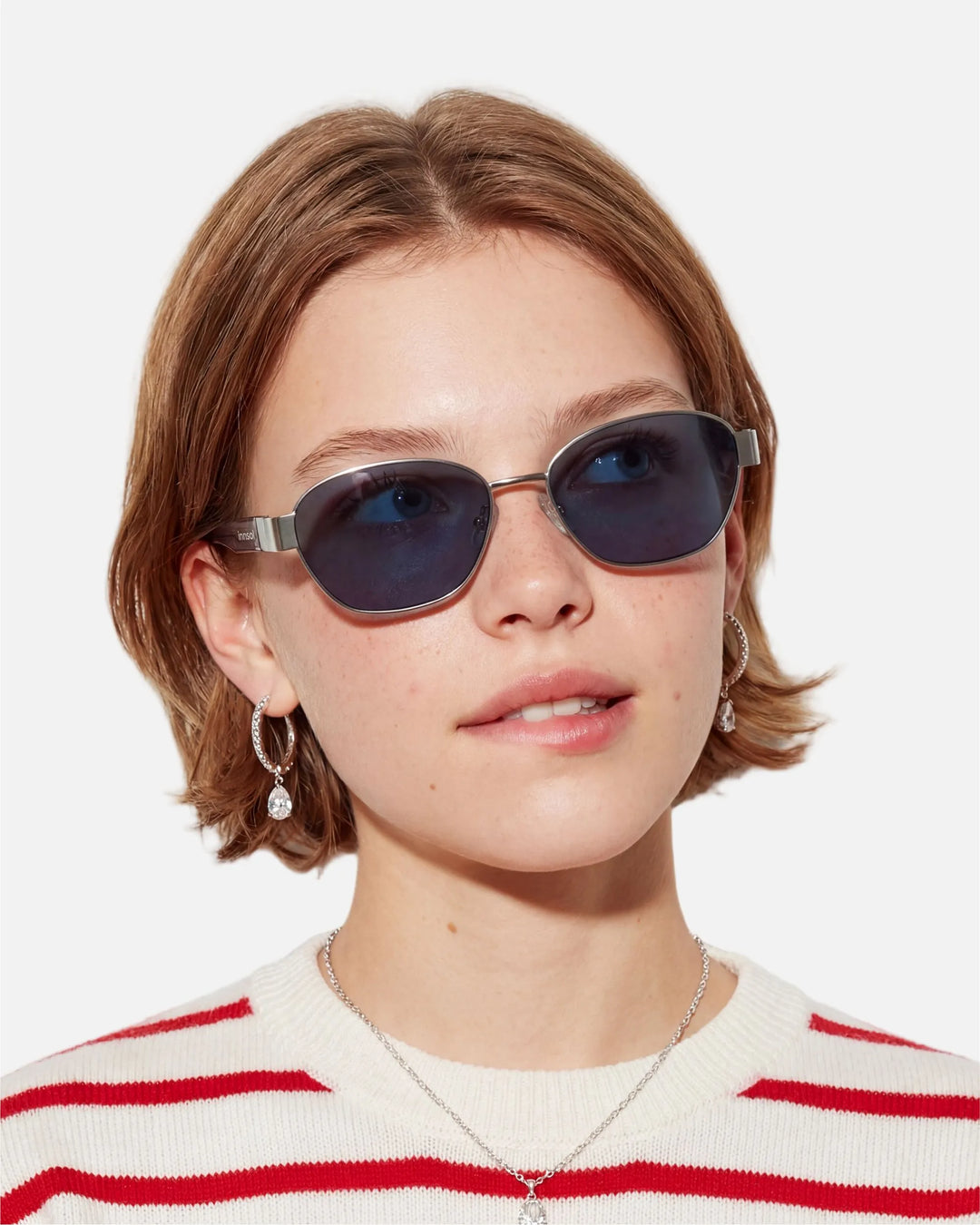Model wearing innsol Bate Y2K oval cat eye metal sunglasses for vacation outfits, festival styling, selfies, and elevated everyday looks