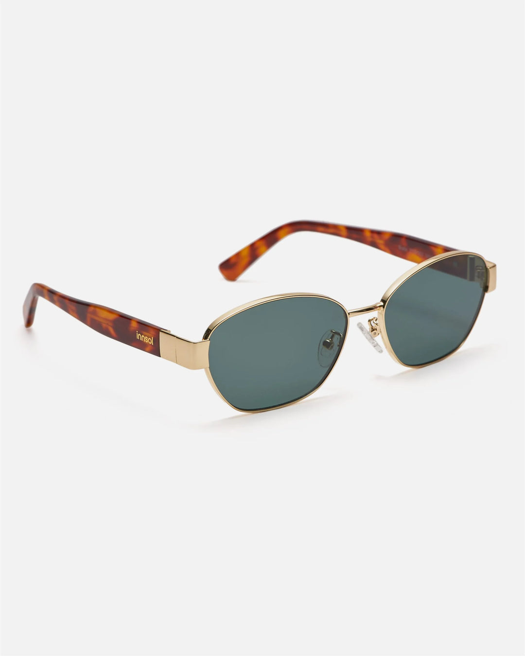 Side view of innsol Bate sunglasses showing gold metal frame and green lenses