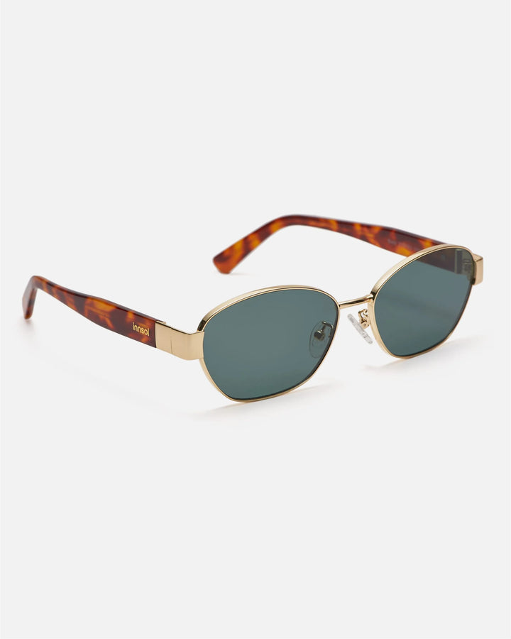 Side view of innsol Bate sunglasses showing gold metal frame and green lenses
