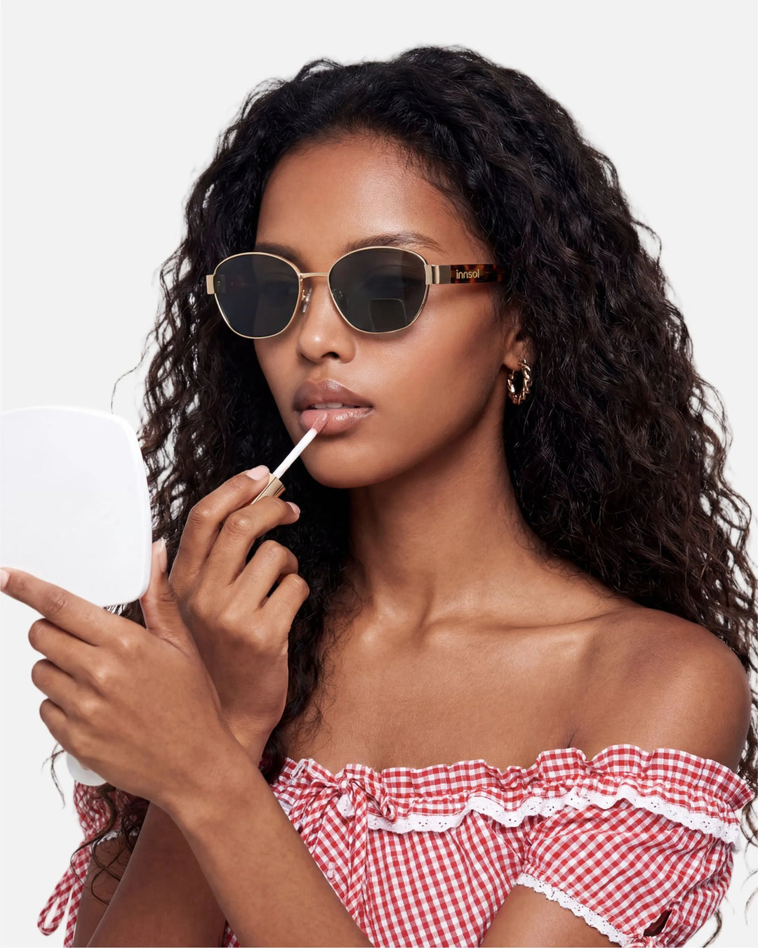 Model wearing innsol Bate Y2K oval cat eye metal sunglasses for vacation outfits, festival styling, selfies, and elevated everyday looks