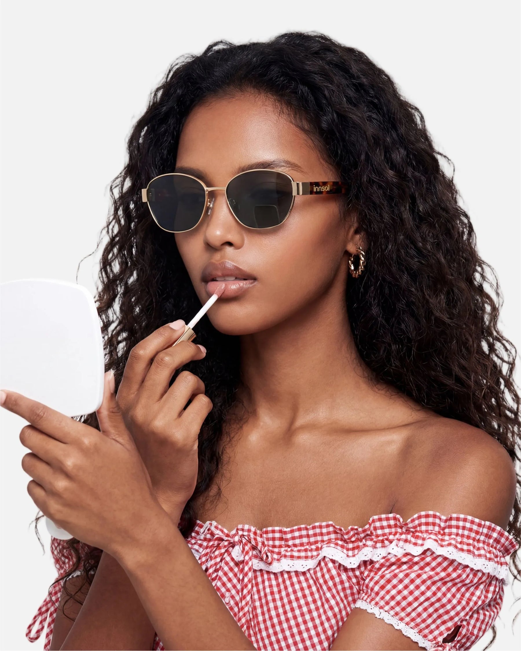Model wearing innsol Bate Y2K oval cat eye metal sunglasses for vacation outfits, festival styling, selfies, and elevated everyday looks