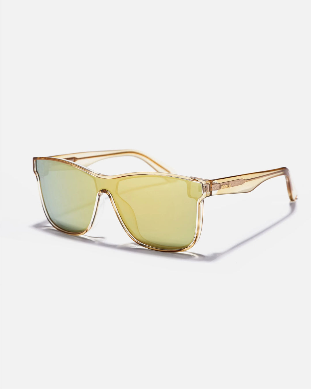 Alternate side angle of innsol Halo sunglasses featuring smooth one-piece shield lens and lightweight frame in transparent gold