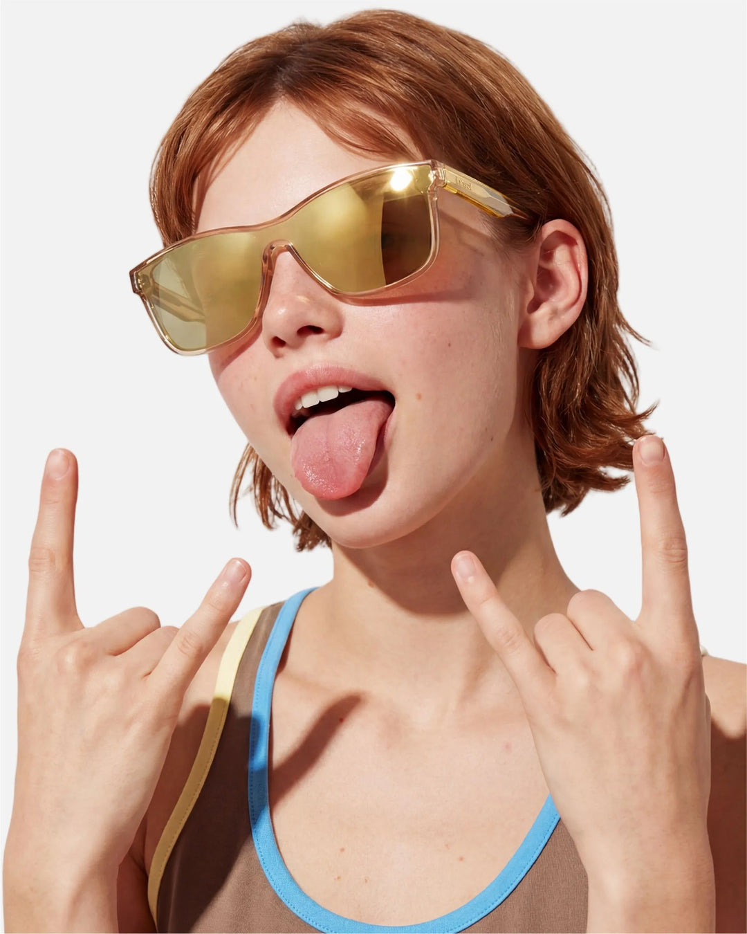 Model wearing innsol Halo one-piece rectangular shield sunglasses for city commute, resort days, and bold street styling