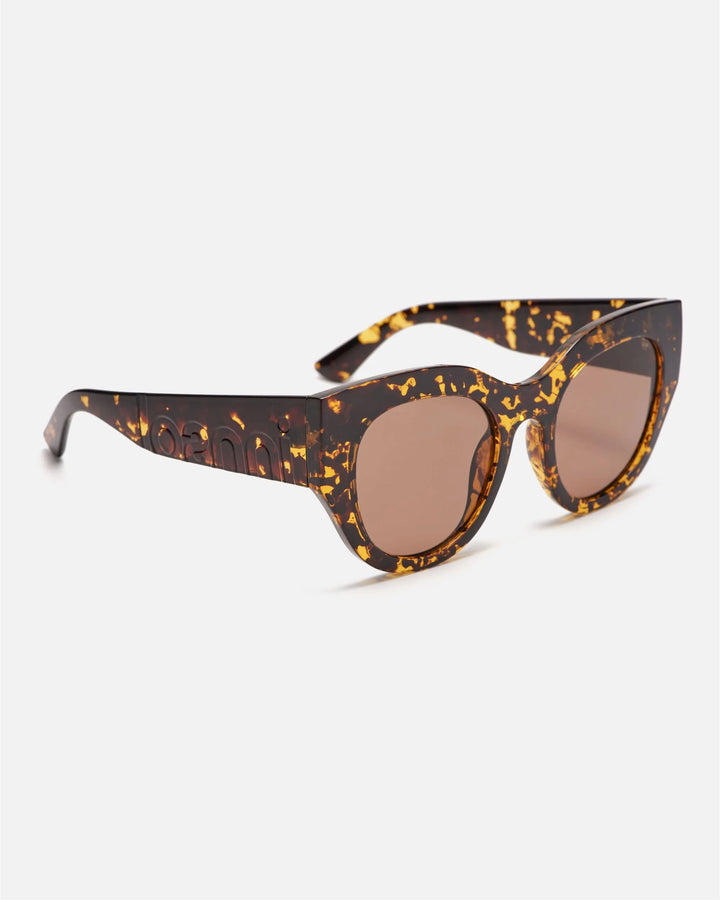 Side view of innsol Lilly sunglasses showing transparent tortoise lightweight frame and brown lenses