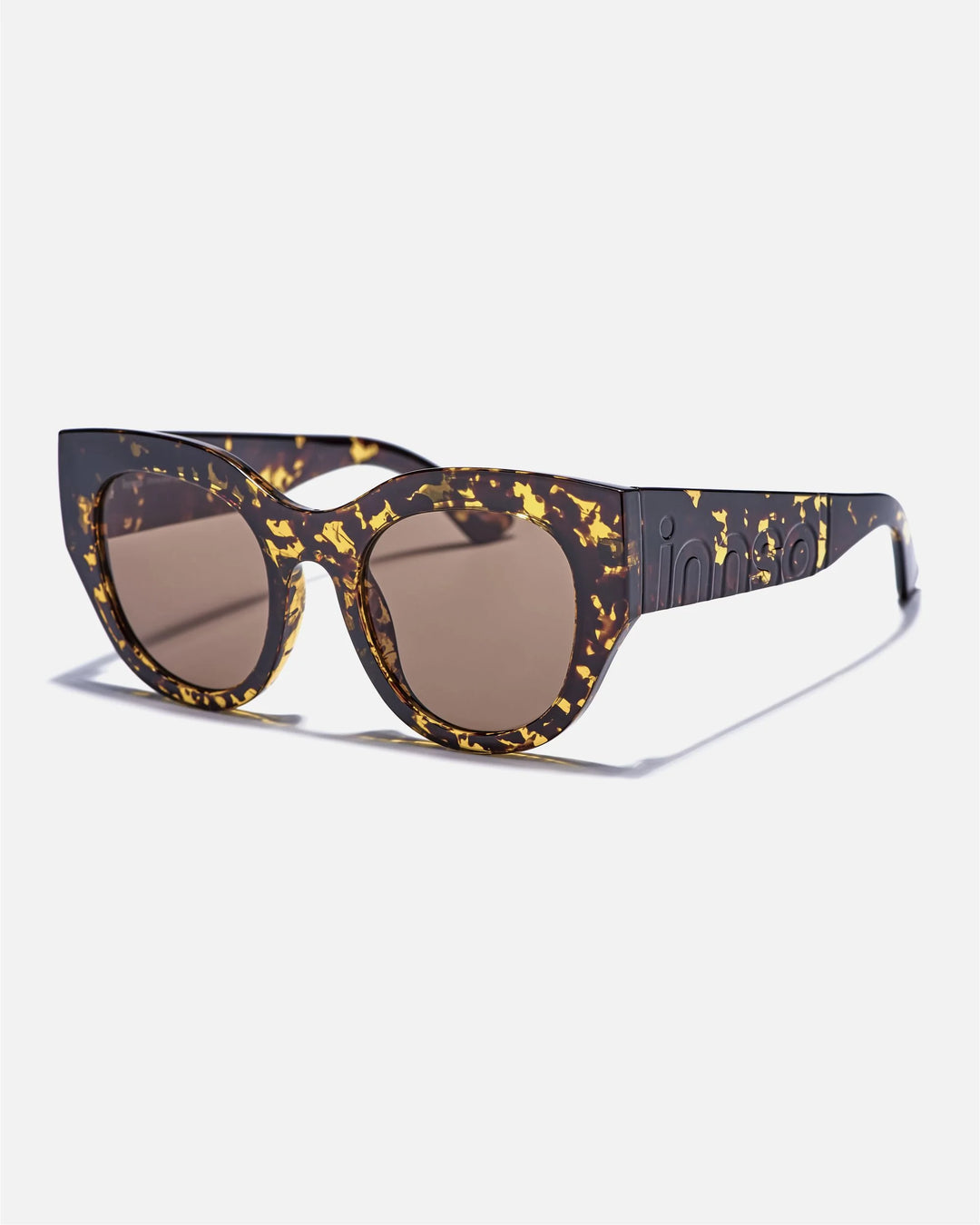 Alternate side angle of innsol Lilly sunglasses featuring oversized cat eye front, chunky temples, and face-framing coverage in transparent tortoise