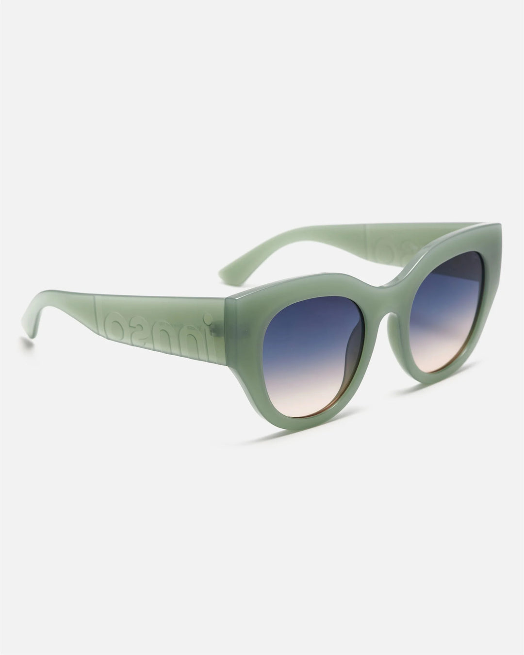 Side view of innsol Lilly sunglasses showing milky green lightweight frame and gradient green lenses
