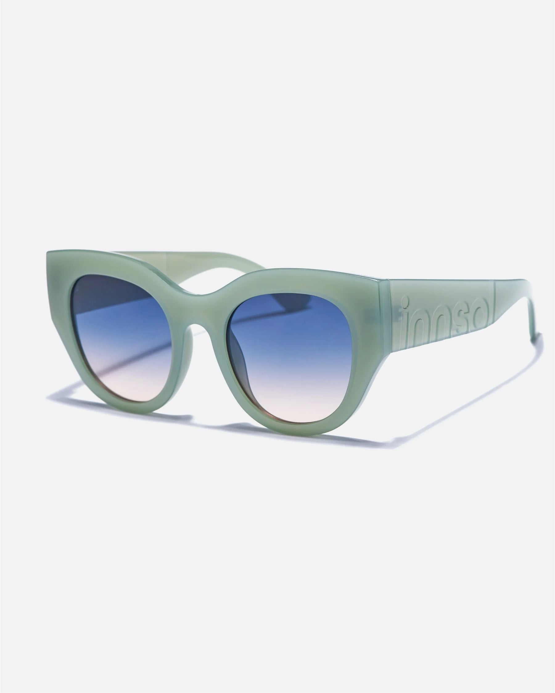Alternate side angle of innsol Lilly sunglasses featuring oversized cat eye front, chunky temples, and face-framing coverage in milky green