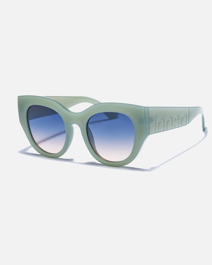 Alternate side angle of innsol Lilly sunglasses featuring oversized cat eye front, chunky temples, and face-framing coverage in milky green