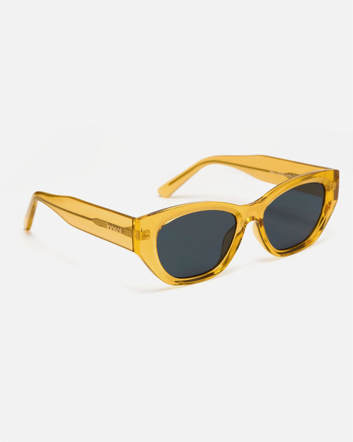 Side view of innsol Mesa sunglasses showing transparent yellow lightweight frame and gray lenses
