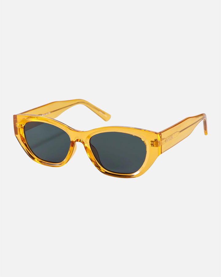 Alternate side angle of innsol Mesa sunglasses featuring upswept cat eye frame and lightweight everyday shape in transparent yellow