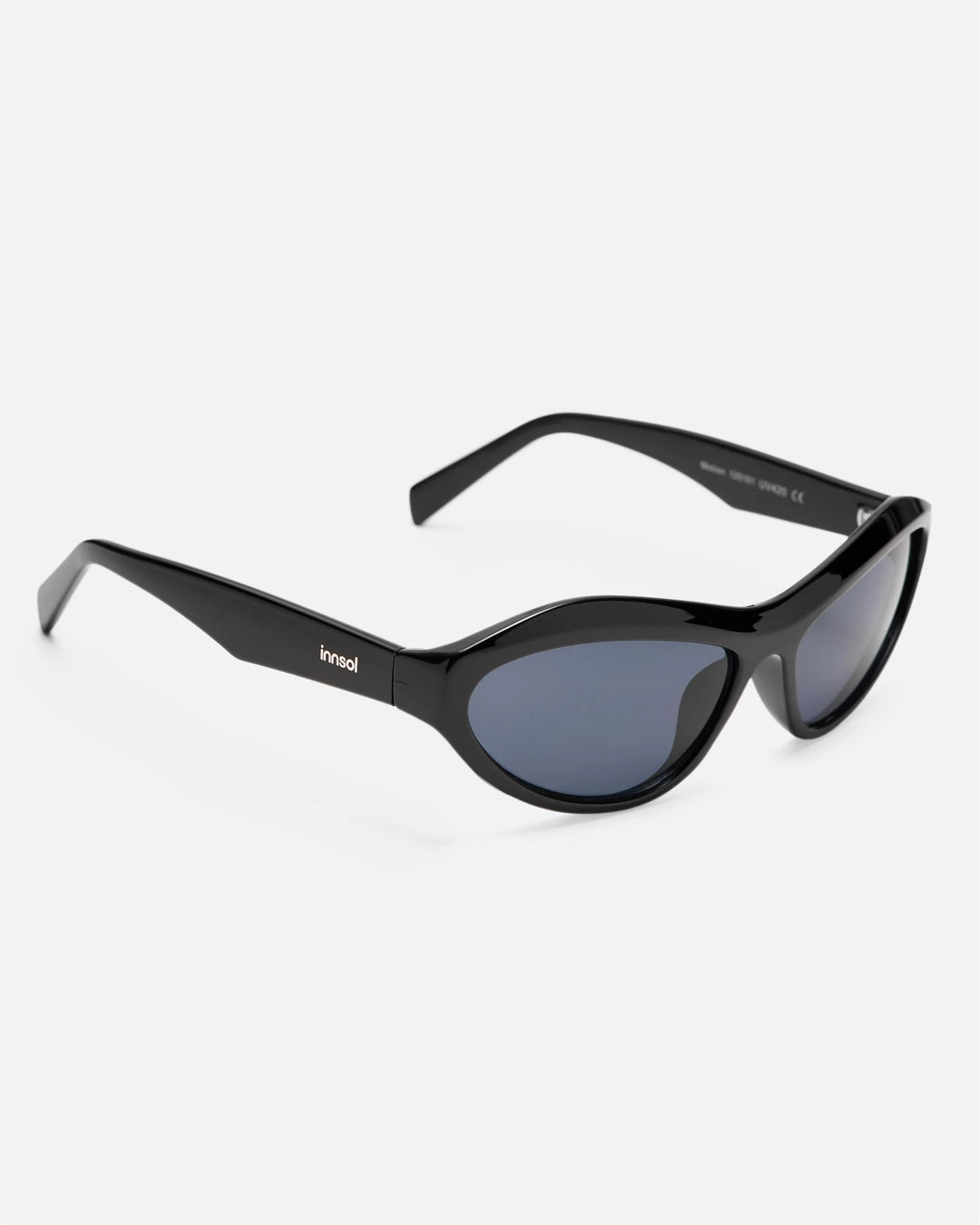Side view of innsol Motion sunglasses showing gloss black lightweight frame and gray lenses