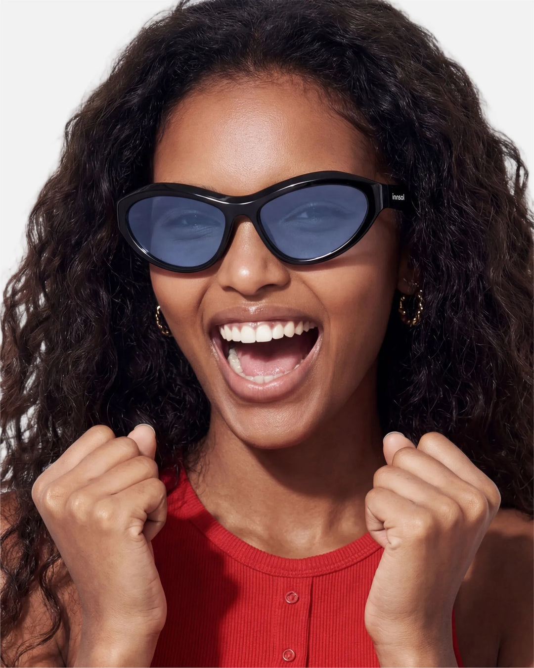 Model wearing innsol Motion Y2K wraparound sunglasses for techwear looks, festivals, active sunny days, and streetwear styling