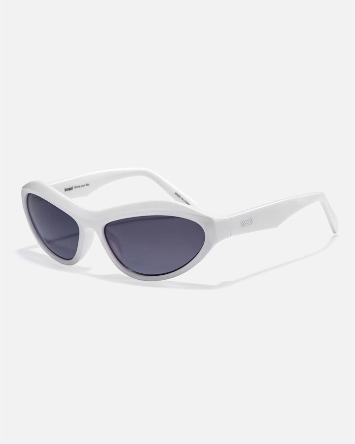 Alternate side angle of innsol Motion sunglasses featuring wraparound frame, upswept profile, and Y2K streetwear shape in transparent pink