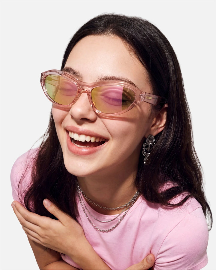 Model wearing innsol Motion Y2K wraparound sunglasses for techwear looks, festivals, active sunny days, and streetwear styling