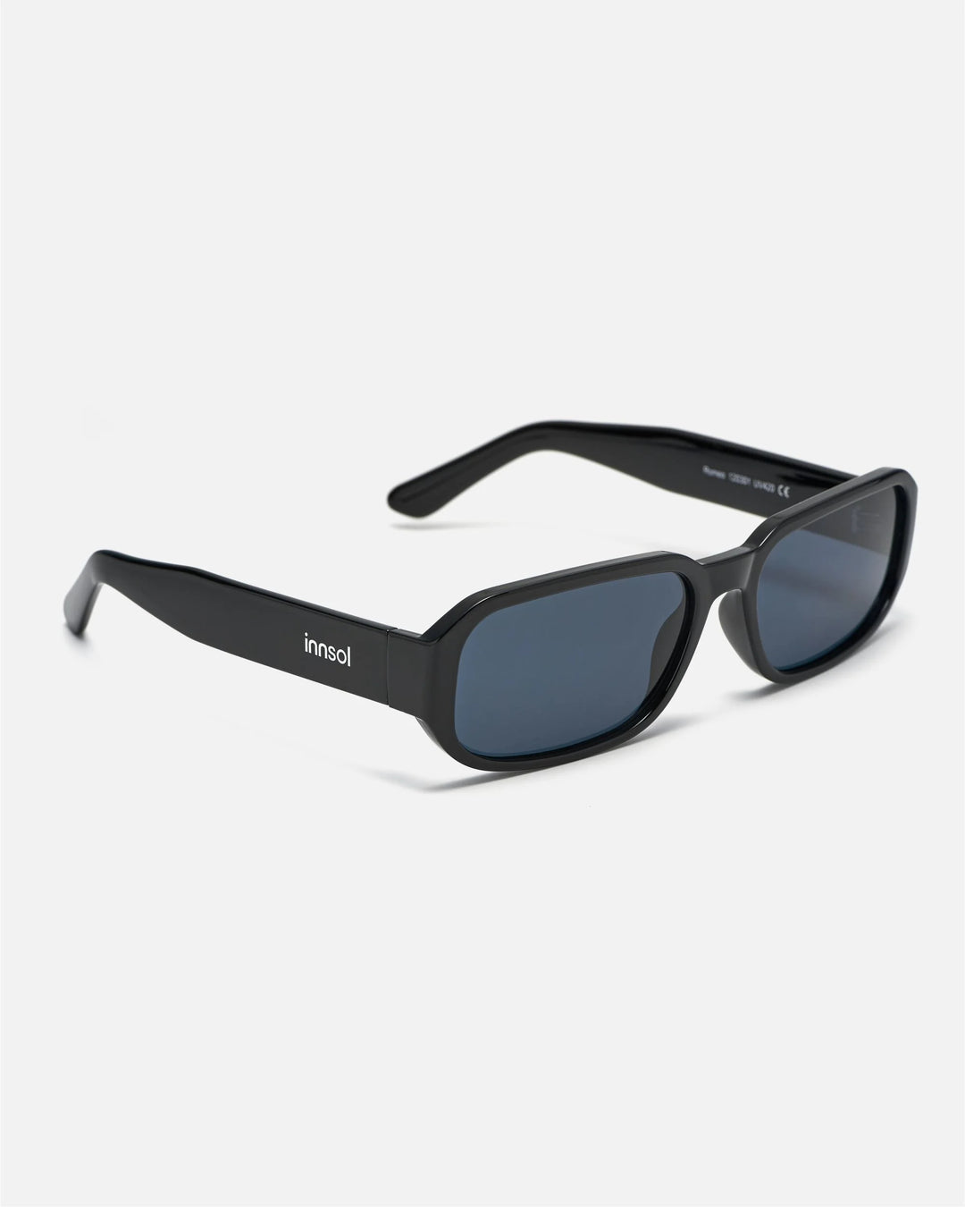 Side view of innsol Romeo sunglasses showing gloss black lightweight frame and gray lenses
