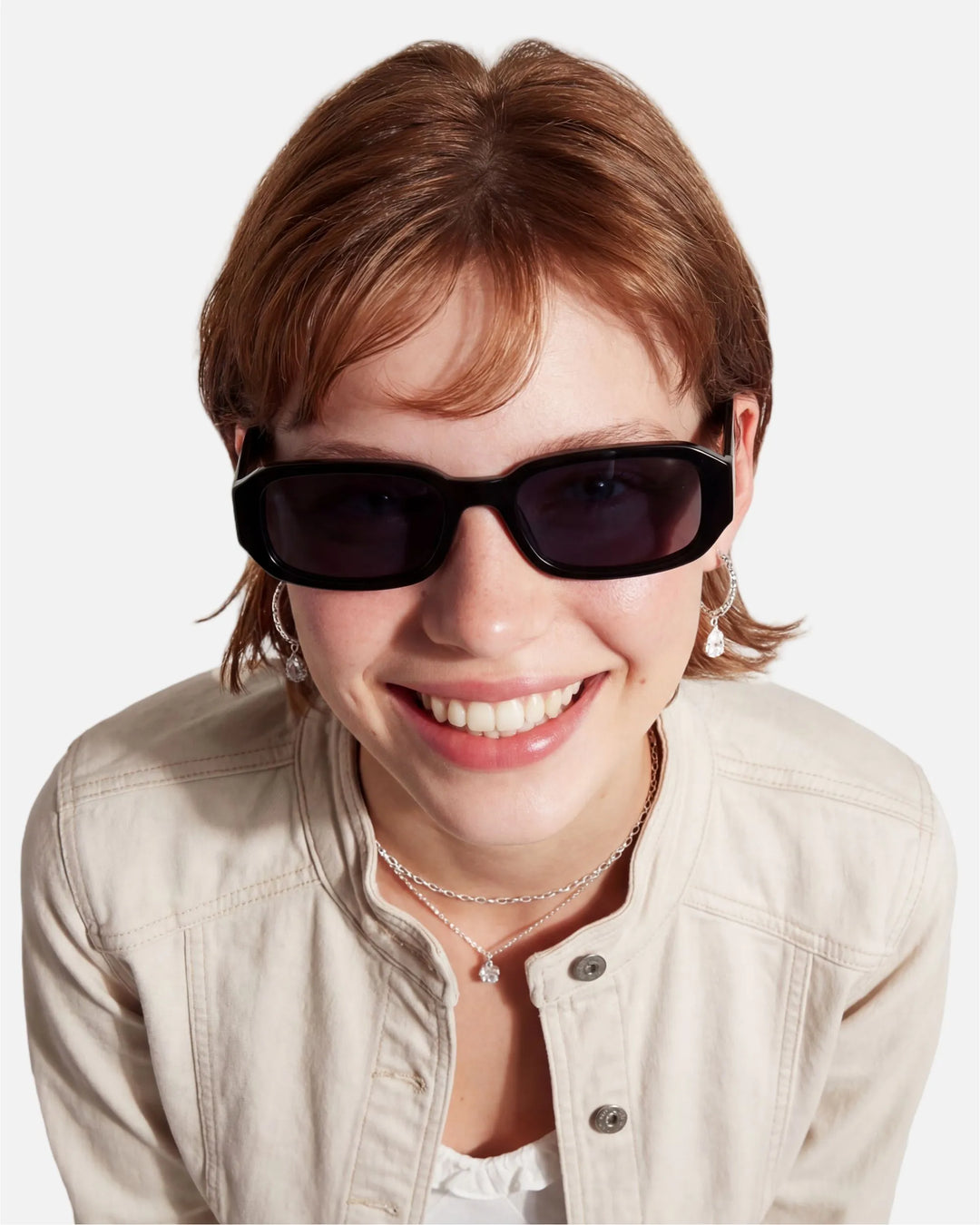 Model wearing innsol Romeo minimalist small rectangular sunglasses for small-face styling, casual city outfits, and Y2K everyday looks