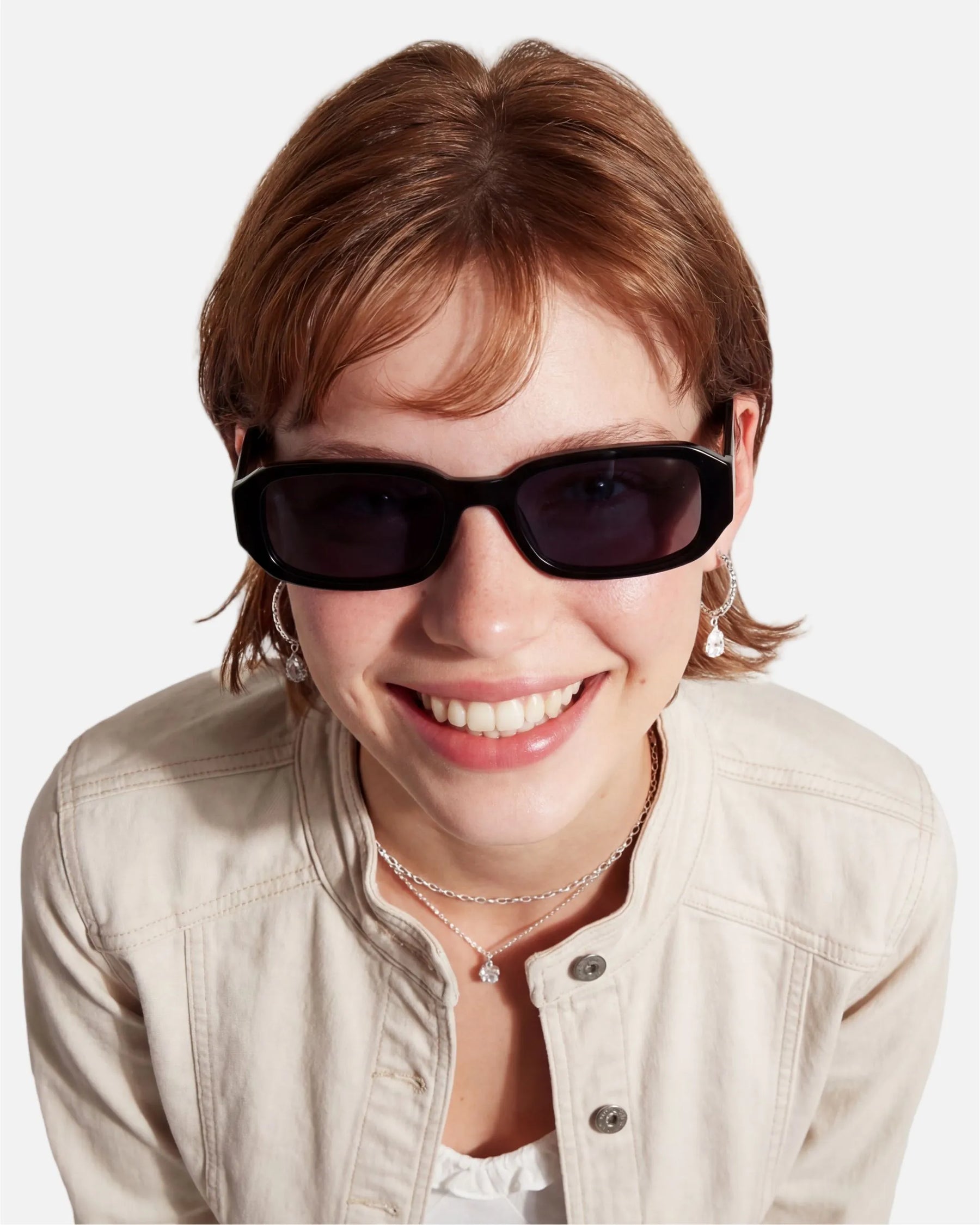 Model wearing innsol Romeo minimalist small rectangular sunglasses for small-face styling, casual city outfits, and Y2K everyday looks