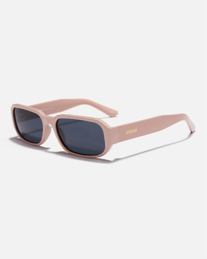 Alternate side angle of innsol Romeo sunglasses featuring small rectangular frame, slim temples, and clean minimalist profile in gloss solid pink