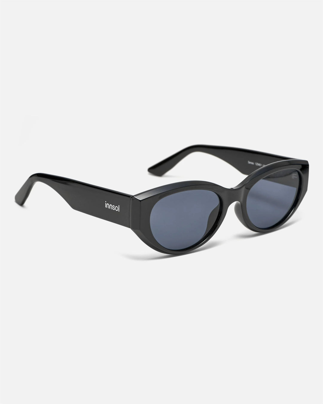 Side view of innsol Series sunglasses showing gloss black lightweight frame and gray lenses