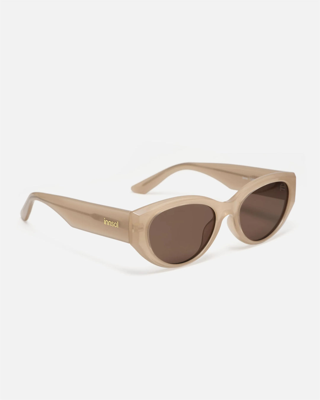 Side view of innsol Series sunglasses showing beige lightweight frame and dark brown lenses