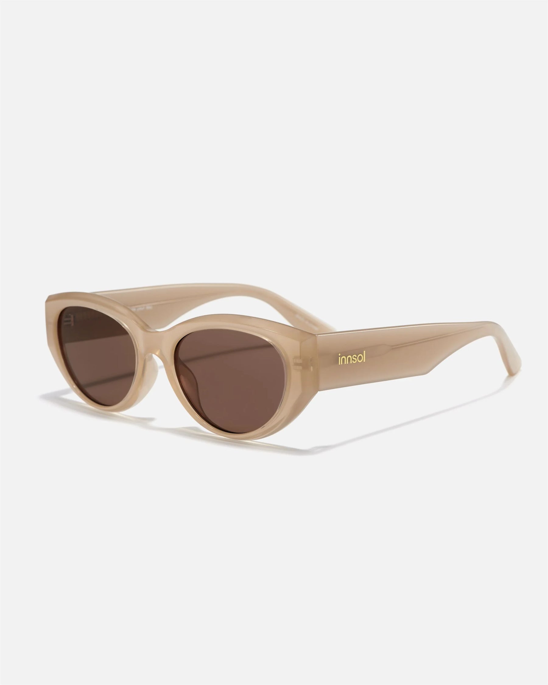 Alternate side angle of innsol Series sunglasses featuring glossy cat eye frame, reinforced hinges, and smooth temples in beige