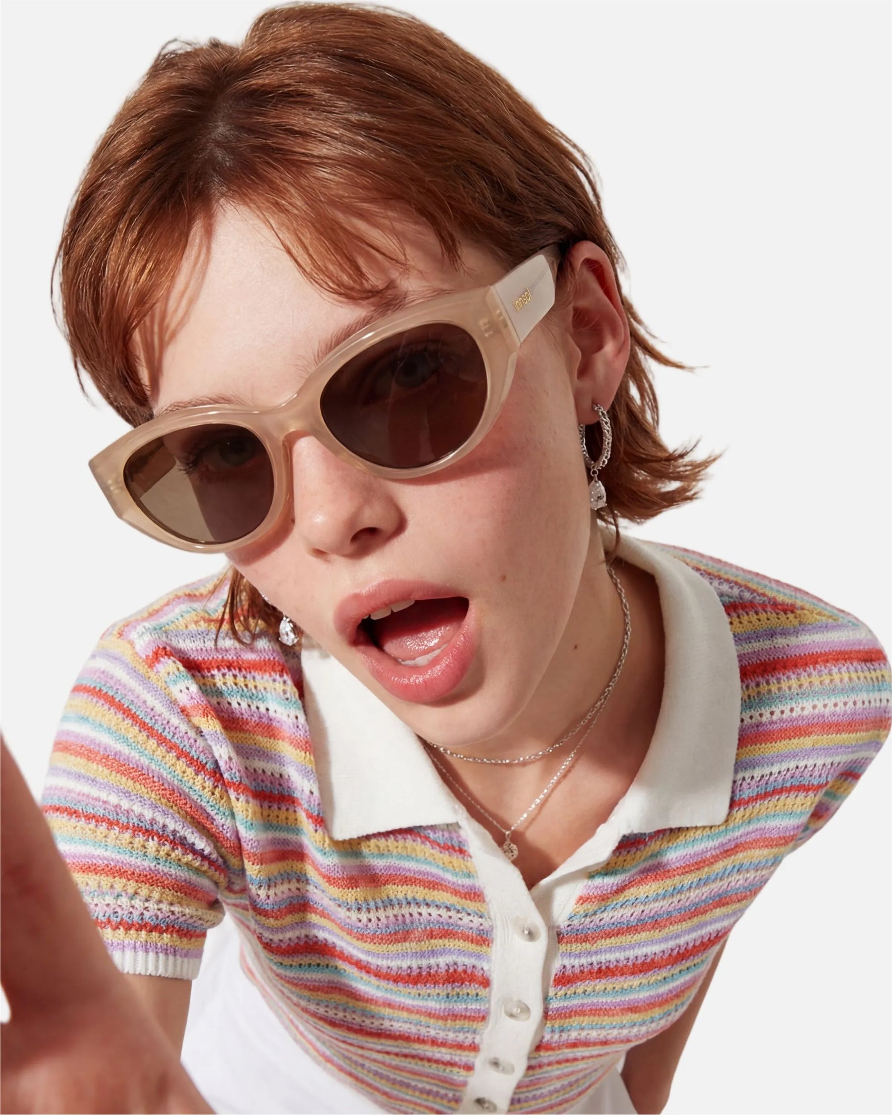 Model wearing innsol Series modern edgy cat eye sunglasses for daily streetwear, brunch looks, and confident city styling