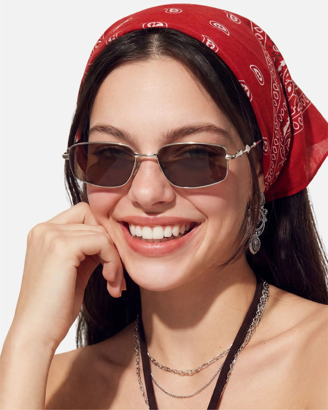 Model wearing innsol Skyway neo-vintage narrow rectangular metal sunglasses for 90s-inspired city outfits, vacation styling, and sunny weekend plans