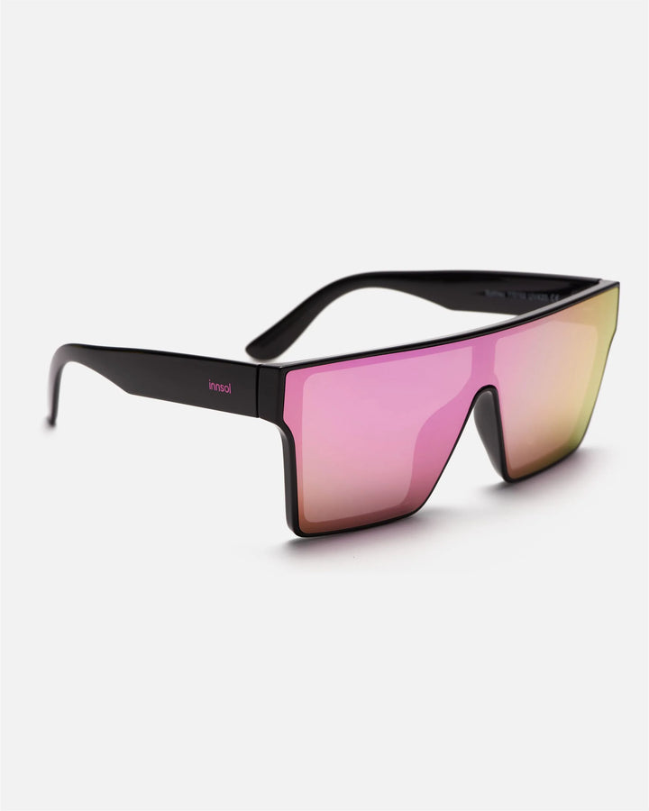 Side view of innsol Sydney sunglasses showing gloss black lightweight frame and pink mirrored lenses