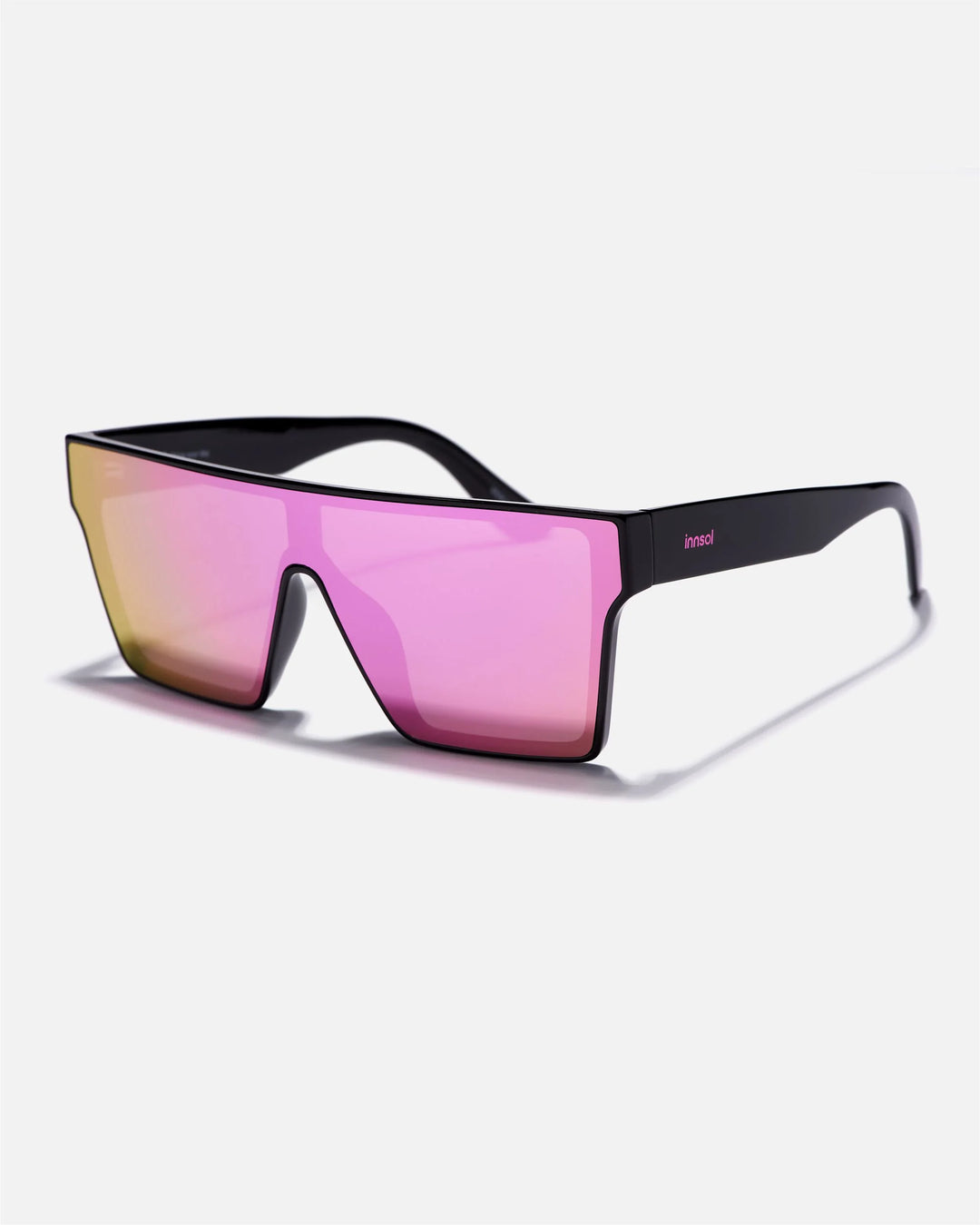 Alternate side angle of innsol Sydney sunglasses featuring oversized shield visor lens and smooth frame in gloss black