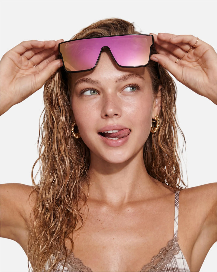 Model wearing innsol Sydney oversized one-piece shield visor sunglasses for festivals, pool days, street photography, and high-energy social content