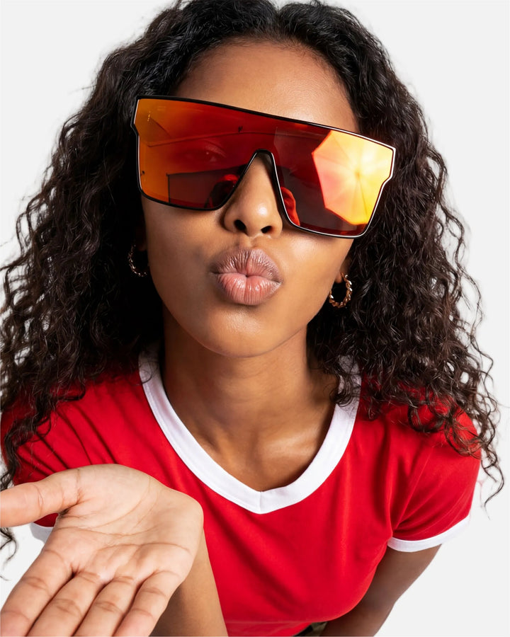 Model wearing innsol Sydney oversized one-piece shield visor sunglasses for festivals, pool days, street photography, and high-energy social content