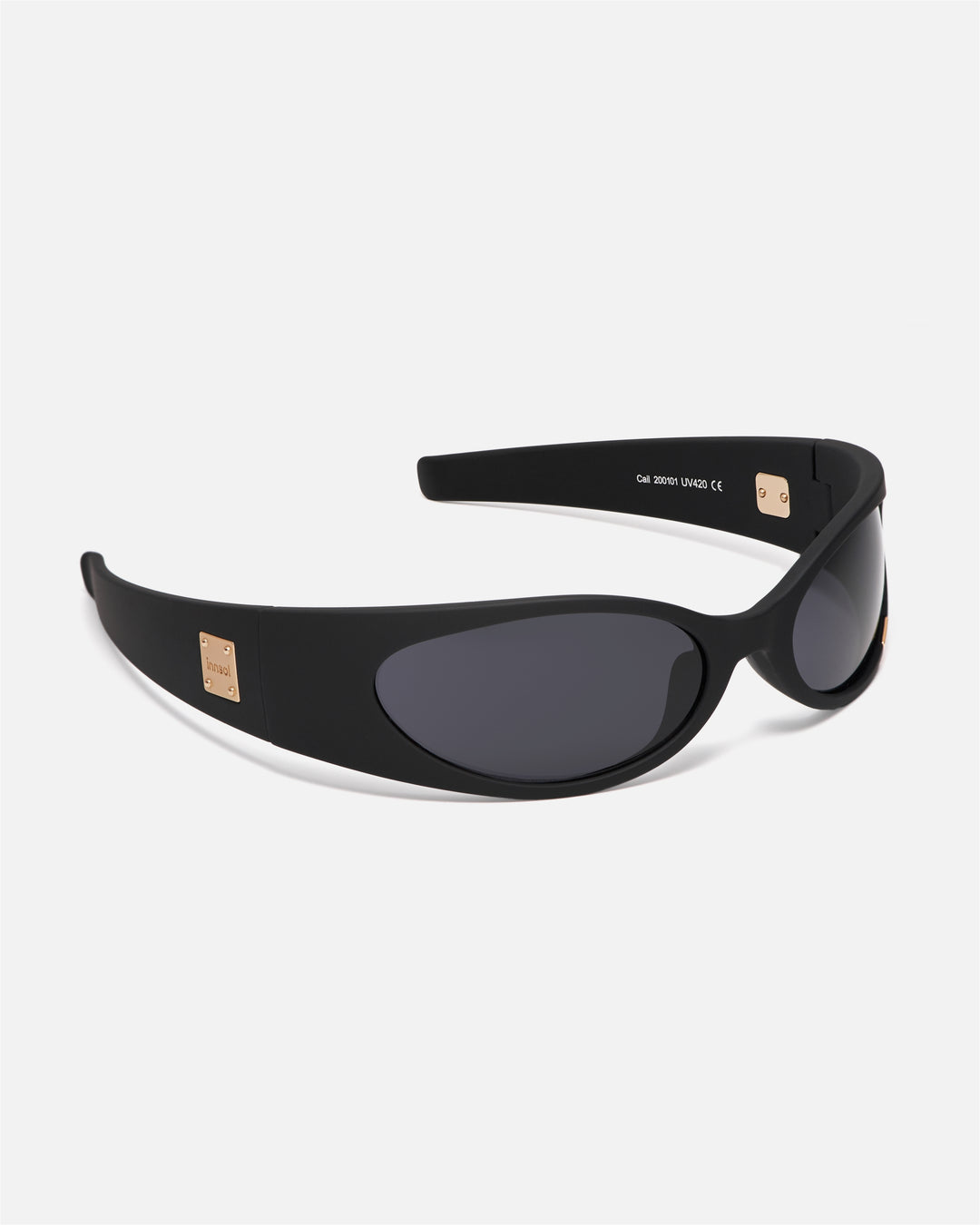 Angled view of innsol Cail Matt Black sunglasses with gray lenses